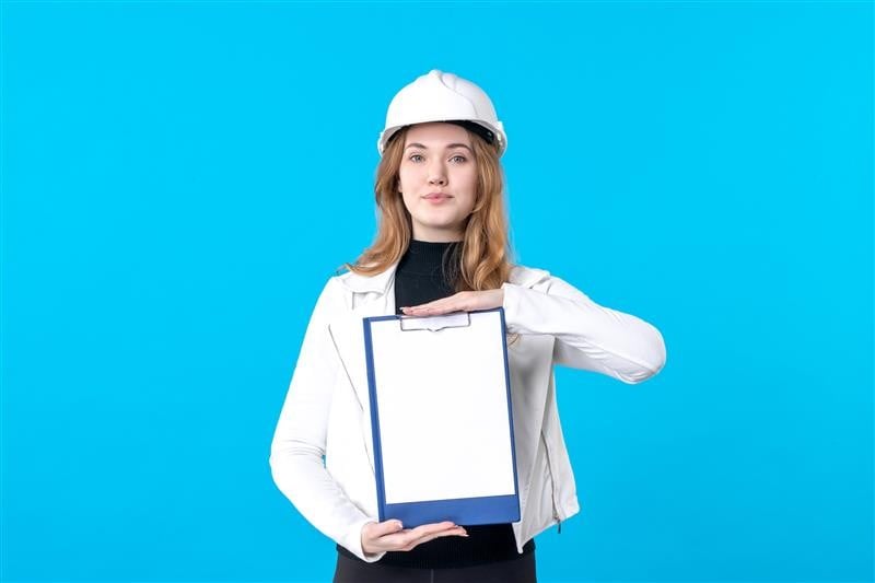 b2ap3_large_front-view-young-female-architect-holding-file-note-blue Skilled Occupation List for PR in Australia (2025) - Blog